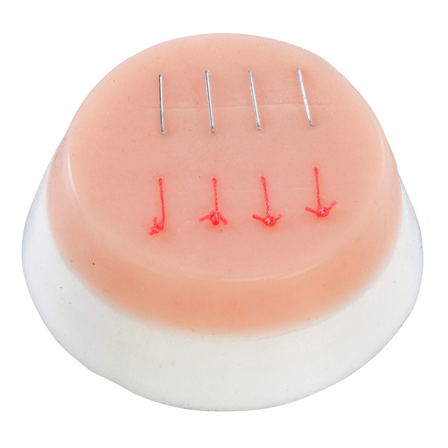 Medical suture practice pad with simulated skin and stitches – clinical training tool photography for healthcare education and surgical skill development in Toronto